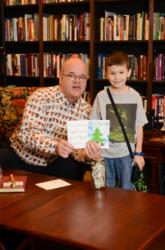 Man exhibits holiday cards designed by 6 year old